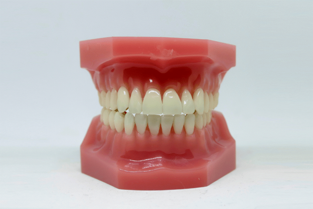 Dentist removing tartar with dental scaling tools
