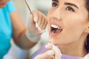 Experienced dentist at Al Bahri Dental Clinic treating a patient